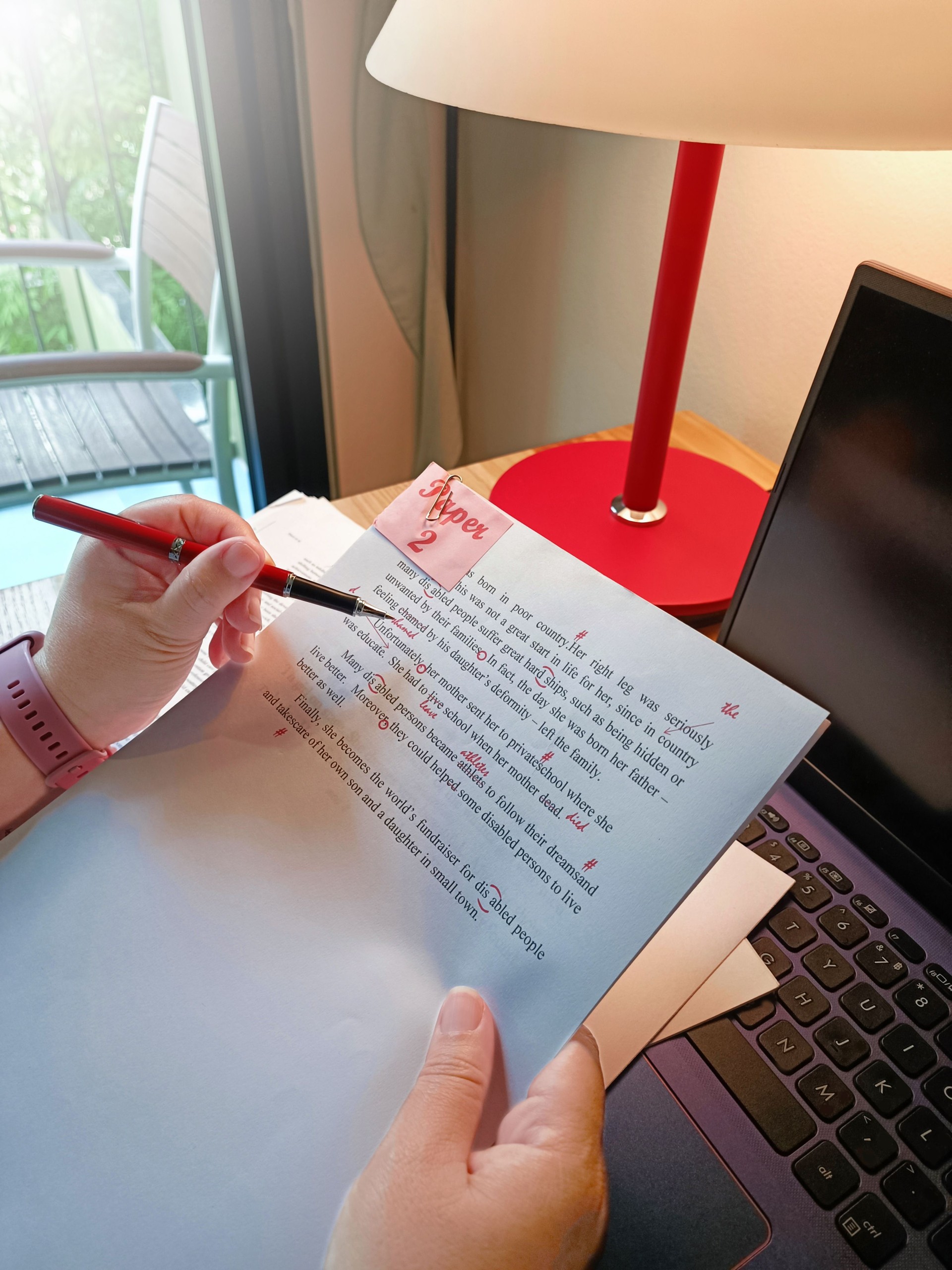 paperwork for proofreading on wooden table